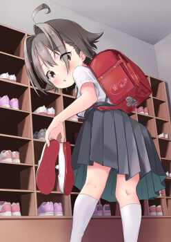 1girl :o absurdres ahoge backpack bag black_eyes brown_hair child collared_shirt commentary_request flipped_hair from_behind grey_skirt hair_intakes highres holding holding_shoes holding_unworn_clothes indoors kneehighs looking_at_viewer looking_back medium_hair open_mouth original pleated_skirt randoseru red_bag school_uniform shirt shoes short_sleeves skirt socks solo suspender_skirt suspenders two-sided_fabric two-sided_skirt unworn_shoes uwabaki white_shirt white_socks yappariga