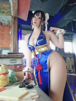 1girl breasts capcom chinese_clothes chun-li chun-li_(cosplay) cleavage cosplay cosplay_photo female_focus highres large_breasts photo_(medium) real_life solo street_fighter tirotiromaru