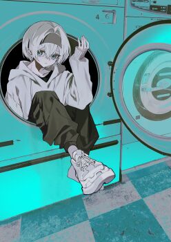 1girl absurdres black_pants blue_eyes clothes_dryer commentary_request flat_color headband highres hood hoodie in_washing_machine indoors laundromat laundry limited_palette original pants shoes si_(wooupp) sneakers solo spot_color tile_floor tiles washing_machine what white_hoodie