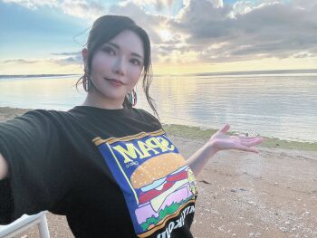 Rule 34 | 1girl, asian, black hair, black shirt, breasts, brown eyes, cloud, cloudy sky, earrings, female focus, highres, huge breasts, japanese (nationality), jewelry, looking at viewer, makeup, nature, okita anri, outdoors, photo (medium), real life, shirt, sky, spam (food), standing, sun, water