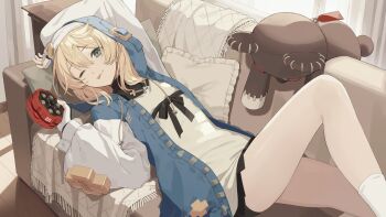 1boy :p aqua_eyes belt bike_shorts bike_shorts_under_skirt black_belt black_collar black_skirt blonde_hair blue_jacket bridget_(guilty_gear) collar commentary couch crossdressing crossdressing_(mtf) drawstring fingerless_gloves from_above gloves guilty_gear highres holding hood hood_up hooded_jacket hoodie jacket long_sleeves looking_at_viewer lying male_focus multicolored_jacket on_couch one_eye_closed open_clothes open_hoodie pillow pleated_skirt puffy_sleeves rcs_4 roger_(guilty_gear) shirt skirt socks solo stuffed_toy tongue tongue_out trap two-tone_jacket white_shirt white_socks yo-yo