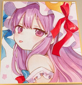 1girl :p blue_bow blush bow commentary_request crescent crescent_hat_ornament hair_bow hat hat_bow hat_ornament highres long_hair looking_at_viewer mob_cap moni_monico patchouli_knowledge photo_(medium) purple_eyes purple_hair red_bow shikishi solo tongue tongue_out touhou traditional_media