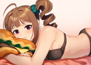 1girl ahoge armpit_peek ass bed_sheet black_bra black_panties blush bra brown_hair burger drill_hair food gradient_background green_scrunchie hugging_object idolmaster idolmaster_million_live! kamille_(vcx68) lying on_stomach panties pillow pillow_hug purple_eyes scrunchie side_drill side_ponytail sidelocks smile solo underwear underwear_only yokoyama_nao