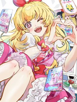 1girl ;d aikatsu! aikatsu!_(series) arcade_cabinet blonde_hair bow bow_hairband card collared_shirt commentary_request hair_bow hairband hands_up heart heart_hands highres hoshimiya_ichigo idol_clothes jacket kiriya_aoi knees_up long_hair looking_at_viewer one_eye_closed open_mouth petticoat pink_jacket pink_skirt red_bow red_eyes red_hairband shibuki_ran shichiko_(kerori) shirt skirt smile solo white_shirt