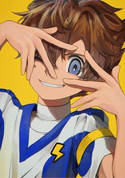 1boy absurdres armband arms_up blue_eyes brown_hair dame! dutch_angle eyelashes grin hair_between_eyes hand_over_eye highres inazuma_eleven_(series) inazuma_eleven_go lightning_bolt_symbol looking_at_viewer male_focus matsukaze_tenma one_eye_closed parted_bangs sanpaku shirt short_hair simple_background smile soccer_uniform solo sportswear teeth upper_body white_shirt yellow_armband yellow_background