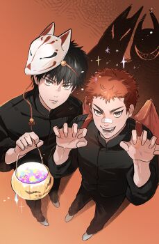 2boys absurdres arms_up black_hair black_jacket black_pants brown_eyes candy claw_pose closed_mouth commentary demon_wings didihana1110 different_shadow english_commentary food fox_mask halloween_bucket highres holding jacket looking_at_viewer male_focus mask mask_on_head multiple_boys open_mouth pants red_hair rukawa_kaede sakuragi_hanamichi sanpaku short_sideburns slam_dunk_(series) smile standing teeth wings