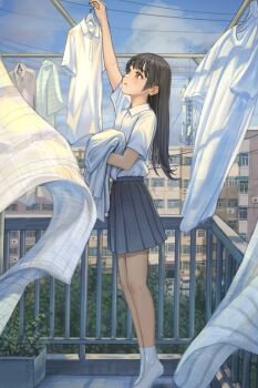 1girl absurdres arm_up balcony black_hair black_skirt brown_eyes cityscape clothes_hanger cloud cloudy_sky commentary_request highres hime_cut laundry laundry_pole long_hair mole mole_on_cheek no_shoes original pleated_skirt scenery school_uniform shirt skirt sky socks solo tiptoes user_vvdr2237 white_shirt white_socks