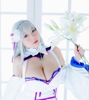 1girl breasts cosplay emilia_(re:zero) emilia_(re:zero)_(cosplay) female_focus flower grey_hair highres holding holding_flower large_breasts long_hair looking_at_viewer model photo_(medium) pointy_ears purple_eyes re:zero_kara_hajimeru_isekai_seikatsu shibuya_kaho solo