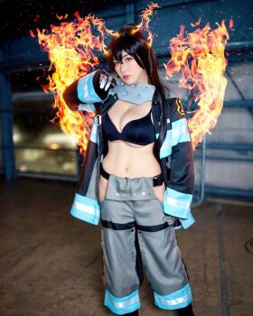 1girl black_bra bra breasts cosplay en'en_no_shouboutai female_focus fire highres large_breasts long_hair looking_at_viewer model partially_undressed photo_(medium) shibuya_kaho smile solo tamaki_kotatsu tamaki_kotatsu_(cosplay) twintails underwear wig