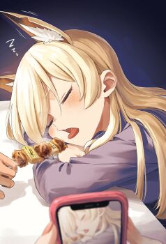animal_ear_fluff animal_ears blonde_hair blue_archive blue_shirt blush cellphone commentary_request dog_ears dog_girl extra_ears food hair_over_one_eye highres kanna_(blue_archive) long_hair long_sleeves mocha_kichi notched_ear out_of_frame phone recording sharp_teeth shirt shish_kebab sleeping sleeping_on_desk smartphone solo_focus spoken_zzz swept_bangs teeth tongue tongue_out zzz