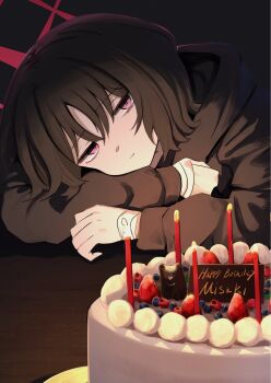1girl arms_on_table bags_under_eyes bandaged_wrist bandages birthday birthday_cake black_background black_hair black_hoodie blue_archive blueberry cake candle candlelight commentary coralreef966 english_text food fruit halo happy_birthday head_rest highres hood hoodie light_smile looking_at_viewer misaki_(blue_archive) purple_eyes red_halo short_hair solo strawberry table