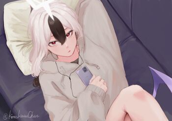 1girl arm_behind_head black_hair blue_archive cellphone closed_mouth couch demon_wings earphones grey_sweater halo hand_on_own_stomach highres indoors kayoko_(blue_archive) komekasuchan long_hair looking_at_viewer lying multicolored_hair on_couch phone pillow red_eyes single_wing smartphone solo sweater two-tone_hair white_hair white_halo wings