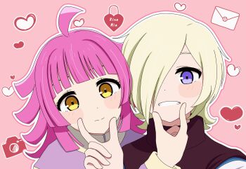 Rule 34 | 2girls, absurdres, ahoge, blonde hair, blush, camera, closed mouth, commentary request, envelope, grin, heart, heart-shaped lock, heart background, highres, hiiragi (67snkt), jacket, kishimen hair, looking at viewer, love live!, love live! nijigasaki high school idol club, medium hair, mia taylor, multiple girls, pink background, pink hair, purple eyes, purple jacket, smile, tennoji rina, turtleneck, yellow eyes