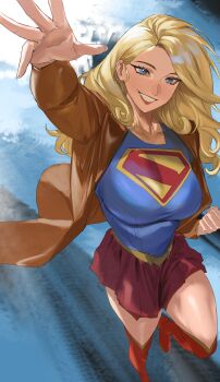 1girl absurdres blonde_hair blue_eyes blue_shirt boots breasts brown_jacket commentary_request dc_comics earrings grin highres jacket jewelry large_breasts long_hair looking_at_viewer reaching reaching_towards_viewer red_boots red_skirt shirt skirt smile solo supergirl supergirl_(2026) superhero_costume superman_(series) superman_logo taiyang_yu