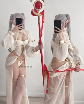 1girl ass bad_tag breasts bustier cosplay earrings frieren jewelry long_sleeves panties pointy_ears real_life revealing_clothes rinnicos selfie sleeve_cuffs sousou_no_frieren staff_(weapon) twintails underwear white_panties