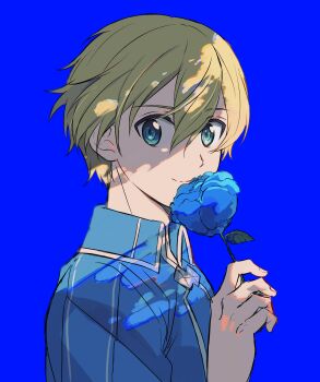 1boy absurdres blonde_hair blue_background blue_flower blue_jacket closed_mouth commentary_request eugeo flower from_side green_eyes highres holding holding_flower jacket looking_at_viewer male_focus short_hair simple_background smile solo sword_art_online toramaru_(696anna)