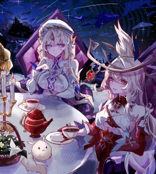2girls alice_(genshin_impact) bare_shoulders beret blonde_hair blue_eyes candle chair commentary cup cutedogggggggg detached_sleeves dodoco_(genshin_impact) dress facial_mark forehead_mark genshin_impact hat headgear highres long_hair looking_at_viewer multiple_girls nicole_reeyn parted_lips pointy_ears red_dress red_eyes red_sleeves sitting symbol-only_commentary table teacup teapot white_dress white_hat