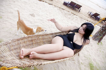 1girl asian black_hair breasts chouzuki_maryou dog large_breasts photo_(medium) plump solo swimsuit