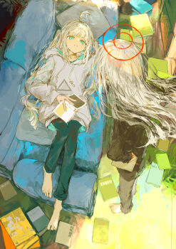 2girls absurdres ahoge arm_behind_head arm_up barefoot black_shirt blue_eyes blue_pants book book_stack commentary couch drawstring grey_hair grey_hoodie grey_pants halo highres hood hood_down hoodie ichika_(ichika87) indoors knee_up long_hair long_sleeves lying multiple_girls on_back on_couch original pants pillow puffy_long_sleeves puffy_sleeves shirt two_side_up very_long_hair