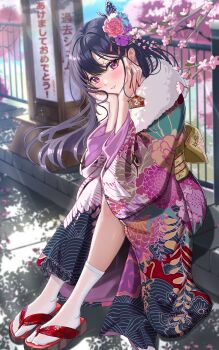 1girl 2025 absurdres black_hair black_kimono blue_kimono cherry_blossoms chinese_zodiac commentary_request day ema floral_print full_body fur-trimmed_kimono fur_trim hair_ornament hands_on_own_face happy_new_year head_rest highres japanese_clothes kanzashi kimono lips long_hair looking_at_viewer multicolored_kimono new_year okobo original outdoors parted_lips pink_eyes pink_nails platform_sandals purple_kimono railing sandals shem_kako sitting smile solo sparkle tabi year_of_the_snake