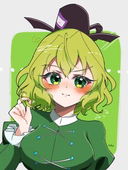 1girl absurdres black_hat blush breasts closed_mouth commentary_request cross-laced_clothes green_background green_eyes hair_intakes hat highres juliet_sleeves large_breasts long_sleeves looking_at_viewer ofuda ofuda_on_clothes puffy_sleeves signature soga_no_tojiko solo tate_eboshi touhou upper_body yuriri2001