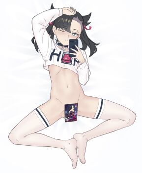 1girl arm_up asymmetrical_bangs black_choker black_hair blush bottomless card cellphone choker closed_mouth clothes_writing crop_top flat_chest from_above full_body green_eyes hair_ribbon happy highres holding holding_phone long_sleeves looking_at_viewer lying marnie_(pokemon) medium_hair navel nintendo on_back one_eye_closed phone pokemon pokemon_(creature) pokemon_swsh ribbon shirt smartphone smile solo split_mouth spread_legs stomach thighhighs twintails vibrantrida white_background white_shirt white_thighhighs