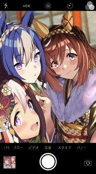 3girls animal_ears blue_hair blush braid brown_hair brown_kimono buena_vista_(umamusume) cesario_(umamusume) checkered_hairband closed_mouth commentary_request crown_braid ear_covers fake_phone_screenshot fake_screenshot fingernails floral_print floral_print_kimono hair_between_eyes hairband highres horse_ears horse_girl horse_tail japanese_clothes kimono looking_at_viewer muku_(yx388140p15) multicolored_hair multiple_girls nail_polish open_mouth print_kimono purple_eyes selfie smile special_week_(umamusume) streaked_hair tail umamusume v white_hair white_streaks yellow_nails