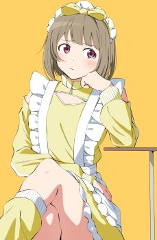 1girl :/ absurdres apron blush bow brown_hair closed_mouth clothing_cutout commentary crossed_legs dress feet_out_of_frame frilled_apron frills hair_bow highres jersey_maid leg_warmers long_sleeves looking_to_the_side love_live! love_live!_nijigasaki_high_school_idol_club maid maid_headdress nakasu_kasumi official_alternate_costume pink_eyes short_hair shoulder_cutout simple_background sitting solo uchuu_no_mozuku unconventional_maid waist_apron white_apron yellow_background yellow_bow yellow_dress yellow_leg_warmers