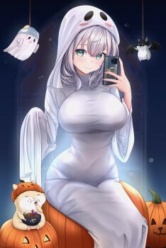 1girl absurdres alternate_costume breasts candy cellphone commentary dan'in-san_(shirogane_noel) food ghost_costume green_eyes grey_hair hair_between_eyes halloween_costume highres holding hololive impossible_clothes jack-o'-lantern large_breasts light_blush long_sleeves looking_at_viewer phone pumpkin shirogane_noel sitting smartphone smile solo symbol-only_commentary virtual_youtuber wide_sleeves zura2822