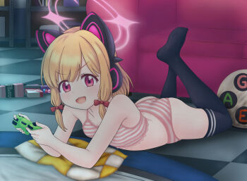 1girl animal_ear_headphones ass blonde_hair blue_archive bra breasts carpet cat_ear_headphones cat_ears controller couch cushion halo headphones looking_at_viewer lying momoi_(blue_archive) on_stomach open_mouth panties red_eyes short_hair small_breasts striped_bra striped_clothes striped_panties thighhighs thighs underwear underwear_only weapon