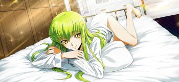 1girl artist_request ass barefoot bed_sheet blurry blurry_background blush bottomless c.c. closed_mouth code_geass code_geass:_lost_stories crossed_arms depth_of_field dutch_angle feet female_focus full_body game_cg green_hair hair_between_eyes happy highres indoors legs light_rays long_hair long_sleeves looking_at_viewer lying non-web_source official_art on_bed on_pillow on_stomach pillow shirt sidelocks smile solo sparkle thighs white_shirt yellow_eyes