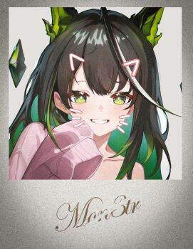 1girl :d ahoge arknights bare_shoulders black_hair bright_pupils cardigan character_name colored_inner_hair commentary_request crystal drawn_ears drawn_whiskers film_grain green_eyes grey_background grin hand_up huge_ahoge kampswe_galong long_hair looking_at_viewer mon3tr_(arknights) multicolored_hair off_shoulder open_mouth photo_(object) pink_cardigan portrait simple_background single_sleeve_past_fingers smile solo white_pupils