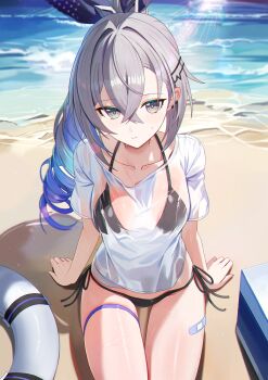 1girl alternate_costume beach bikini bikini_top_under_shirt bikini_under_clothes black_bikini breasts collarbone colored_tips commentary crossed_bangs drill_hair drill_ponytail grey_eyes grey_hair hair_between_eyes highres honkai:_star_rail honkai_(series) innertube looking_at_viewer medium_breasts melreon multicolored_hair ocean shirt side-tie_bikini_bottom silver_wolf_(honkai:_star_rail) single_drill sitting solo swim_ring swimsuit thigh_strap wet wet_clothes wet_shirt white_shirt