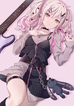 1girl absurdres black_choker black_skirt black_vest brown_nails chain chain_necklace choker closed_mouth collarbone commentary frown grey_shirt grey_skirt guitar hair_between_eyes hair_ornament hairclip heart_pendant highres instrument jewelry long_hair long_sleeves lying multicolored_skirt nail_polish necklace on_back pink_background pink_hair project_sekai red_eyes shirt skirt solo star_(symbol) star_hair_ornament stuffed_animal stuffed_rabbit stuffed_toy symbol-only_commentary tenma_saki thigh_strap timmoo vest zipper