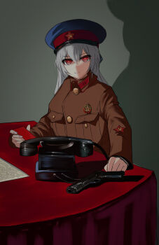 1girl absurdres alternate_costume badge breast_pocket buttons collar_tabs commentary corded_phone english_commentary girls&#039;_frontline glowing glowing_eyes gun hair_between_eyes hammer_and_sickle handgun hat highres jacket long_hair looking_at_viewer military_hat military_jacket military_uniform nkvd peaked_cap phone pistol pk-971 pocket red_eyes red_star semi-automatic_pistol shadow smile soviet star_(symbol) table tokarev_(girls&#039;_frontline) tokarev_tt-33 weapon