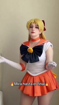 1girl aino_minako animated bishoujo_senshi_sailor_moon blonde_hair blue_eyes bow breasts cosplay dancing gloves heart heart_hands highres long_hair looking_at_viewer miniskirt panties photo_(medium) real_life red_bow sailor_venus sailor_venus_(cosplay) san_chan_claudia short_sleeves skirt solo tagme underwear video