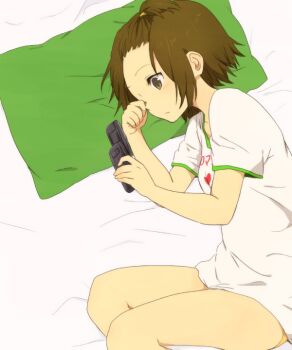 1girl bed_sheet blush brown_eyes brown_hair cellphone flip_phone from_above green_pillow k-on! kakari_(peehs) looking_at_phone lying on_side one_side_up phone rubbing_eyes shirt solo tainaka_ritsu thighs white_shirt yuri