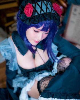 1girl breasts cosplay female_focus headband japanese_(nationality) large_breasts looking_at_viewer model photo_(medium) purple_hair real_life shibuya_kaho sitting solo sono_bisque_doll_wa_koi_wo_suru thighhighs wig