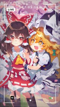 +_+ 2girls absurdres apron ascot back_bow battery_indicator black_hat black_skirt black_vest blonde_hair bloomers blush bow braid brown_hair brown_thighhighs cherry_blossoms closed_mouth collarbone commentary_request detached_sleeves fang frilled_bow frilled_hair_tubes frilled_skirt frills garter_straps green_bow hair_bow hair_tubes hakurei_reimu hand_on_own_hip hat hat_bow highres kirisame_marisa korean_commentary long_hair mixed-language_commentary multiple_girls ofuda open_mouth picklehaterx_x puffy_short_sleeves puffy_sleeves recording red_bow red_eyes red_skirt ribbon-trimmed_skirt ribbon-trimmed_sleeves ribbon_trim short_sleeves side_braid single_braid skirt skirt_set smile thighhighs touhou underwear very_long_hair vest viewfinder waist_apron white_apron white_bloomers white_bow witch_hat yellow_ascot yellow_eyes