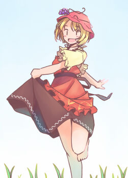 1girl :d aki_minoriko apron black_skirt blonde_hair blue_sky blush commentary_request food-themed_hair_ornament foot_out_of_frame grape_hair_ornament grass hair_ornament hat knees mob_cap open_mouth rangycrow red_apron red_hat shirt short_hair skirt skirt_hold sky smile solo thighs touhou walking yellow_shirt |_|