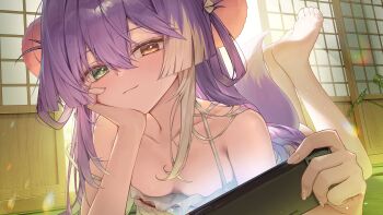 1girl absurdres backlighting bare_shoulders barefoot clrawing collarbone commentary_request feet_up fox_girl fox_tail full_body green_eyes hair_between_eyes hair_ornament handheld_game_console head_rest head_tilt heterochromia highres holding holding_handheld_game_console indoors korean_commentary lens_flare light_blush light_particles long_hair looking_at_viewer lying multicolored_hair nintendo_switch on_stomach playing_games playing_video_games pom_pom_(clothes) pom_pom_hair_ornament purple_hair sliding_doors solo stellive tail tenko_shibuki two-tone_hair virtual_youtuber white_hair yellow_eyes