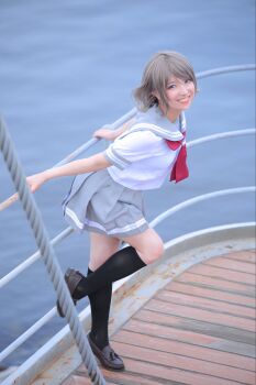Rule 34 | 1girl, blue eyes, boat, brown hair, cosplay, cosplay photo, grey hair, highres, love live!, love live! sunshine!!, necktie, ocean, photo (medium), real life, school uniform, serafuku, short hair, short sleeves, skirt, solo, summer uniform, watanabe you, water, watercraft