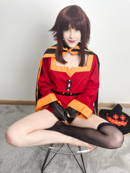 Rule 34 | 1girl, absurdres, barefoot, black cape, black gloves, black hat, black thighhighs, blunt bangs, brown hair, cape, carpet, chair, cosplay, cosplay photo, dress, eyelashes, fingerless gloves, floor, gloves, hat, highres, indian style, kono subarashii sekai ni shukufuku wo!, lips, long hair, long sleeves, looking at viewer, megumin, megumin (cosplay), mole, orange trim, photo (medium), red dress, red eyes, sidelocks, single thighhigh, sitting, smile, solo, stelarhoshi, thighhighs, toes, unworn headwear, wall, witch hat