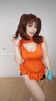 Rule 34 | 1girl, animated, animated gif, blowing kiss, breasts, brown hair, cleavage cutout, clothing cutout, cosplay, diane (nanatsu no taizai), diane (nanatsu no taizai) (cosplay), large breasts, looking at viewer, medium hair, nanatsu no taizai, photo (medium), real life, short sleeves, shorts, twintails, yuno the loose