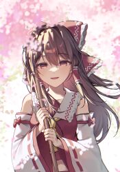 Rule 34 | 1girl, absurdres, ascot, blurry, bow, brown eyes, brown hair, cherry blossoms, commentary, depth of field, detached sleeves, falling petals, frilled bow, frilled hair tubes, frills, hair bow, hair tubes, hakurei reimu, highres, holding, kurobikari, long hair, looking at viewer, open mouth, petals, pink petals, red bow, ribbon-trimmed sleeves, ribbon trim, smile, solo, touhou, yellow ascot
