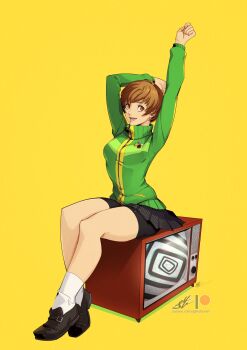 arms_up bike_shorts breasts brown_eyes brown_hair eightyfourart green_jacket highres jacket mary_janes medium_breasts patreon_logo patreon_username persona persona_4 satonaka_chie school_uniform shoes short_hair television thighs tomboy yasogami_school_uniform yellow_background