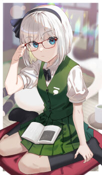 1girl adjusting_eyewear asuka_shirou black_bow black_bowtie black_socks blue_eyes blush book book_on_lap bow bowtie collared_shirt commentary_request cup expressionless glasses green_skirt green_vest hairband hand_on_eyewear highres indoors konpaku_youmu konpaku_youmu_(ghost) looking_at_viewer medium_hair open_book shirt short_sleeves sitting sitting_on_pillow skirt socks solo teacup touhou vest wariza white_hair white_shirt