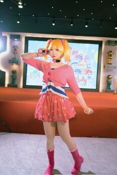 blonde_hair boots bracelet cosplay cosplay_photo digimon digimon_xros_wars digimon_xros_wars:_toki_wo_kakeru_shounen_hunter-tachi hair_ornament hairpin highres jewelry lipstick long_hair looking_at_viewer makeup nochino orange_eyes photo_(medium) pig pink_eyes real_life striped_clothes suzaki_airu twintails