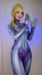 1girl animal_ears animated argentine_(nationality) bare_shoulders before_and_after bikini blonde_hair blue_bikini blue_bodysuit bodysuit breasts cleavage clothes cosplay curvy dressing female_focus highleg highleg_bikini highres indoors leotard lips long_hair looking_at_viewer medium_breasts metroid nintendo photo_(medium) ponytail real_life samus_aran samus_aran_(cosplay) shiny_clothes side-tie_bikini_bottom smile solo sophie_valentine sound swimsuit tagme thong thong_bikini video wide_hips zero_suit