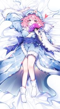 1girl absurdres arm_up bare_legs bed_sheet blue_hat blue_kimono blue_sash blush breasts commentary dakimakura_(medium) floral_print floral_print_kimono folding_fan frilled_kimono frilled_shirt_collar frilled_sleeves frills full_body grin hand_fan hat heart highres hitodama holding holding_fan japanese_clothes kimono large_breasts long_sleeves looking_at_viewer lying mob_cap no_nose no_shoes obi on_back pink_eyes pink_hair print_kimono saigyouji_yuyuko sash sheet_grab short_hair sia_6767 smile socks solo touhou triangular_headpiece white_socks wide_sleeves